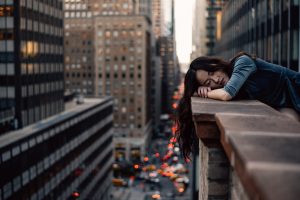 woman-sleeping-on-building-